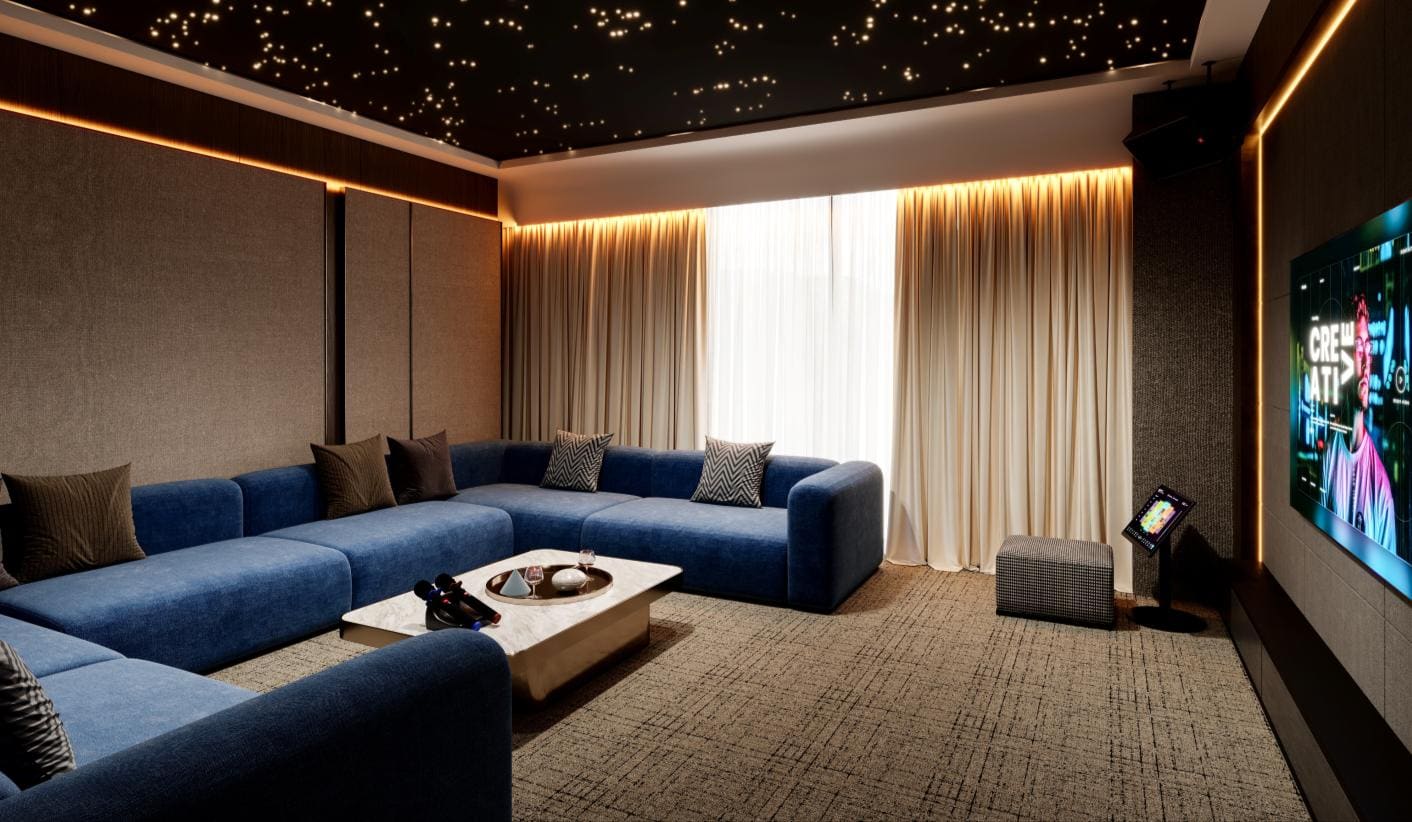 Home theatre lounge at Cappella Embassy with starlit ceiling and tiered seating — artist's impression