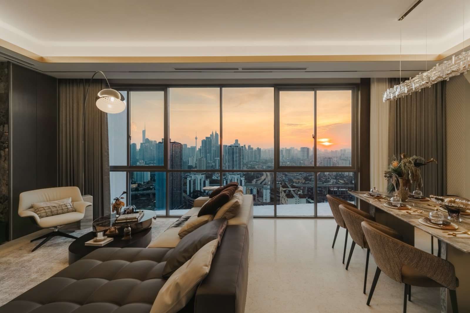 Type C show unit living room at Cappella Embassy at sunset, full-height glazing over Kuala Lumpur — show unit photograph